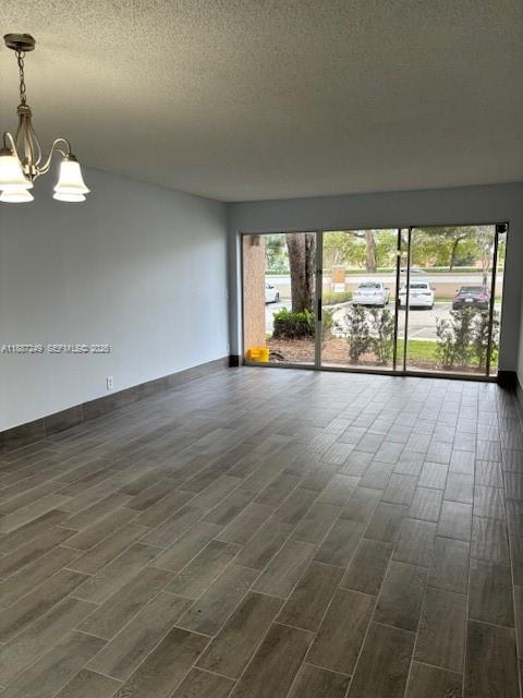 8701 Wiles Road, Unit 103 Coral Springs, FL 33067 - Photo 3 of 15 a view of an empty room with a window