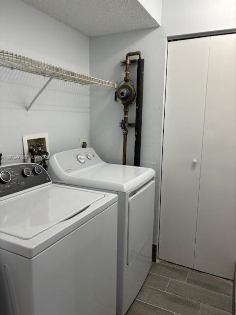 8701 Wiles Road, Unit 103 Coral Springs, FL 33067 - Photo 5 of 15 a utility room with dryer and washer