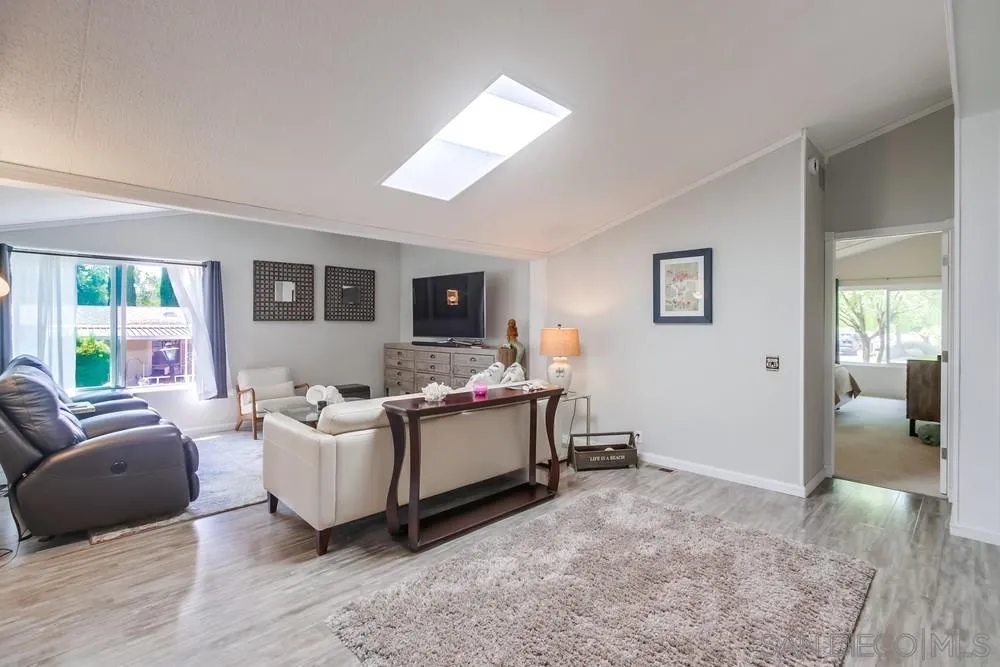 18218 Paradise Mountain Road, Unit 75 Valley Center, CA 92082 - Photo 19 of 68 a living room with furniture and a flat screen tv