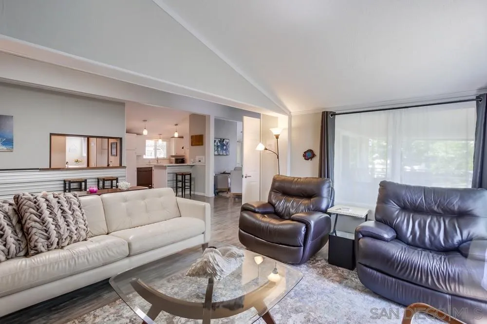 18218 Paradise Mountain Road, Unit 75 Valley Center, CA 92082 - Photo 20 of 68 a living room with furniture and a large window