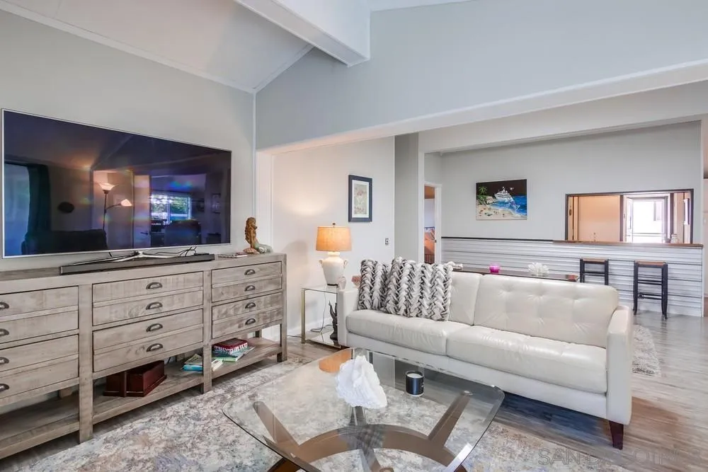 18218 Paradise Mountain Road, Unit 75 Valley Center, CA 92082 - Photo 21 of 68 a living room with furniture and a flat screen tv