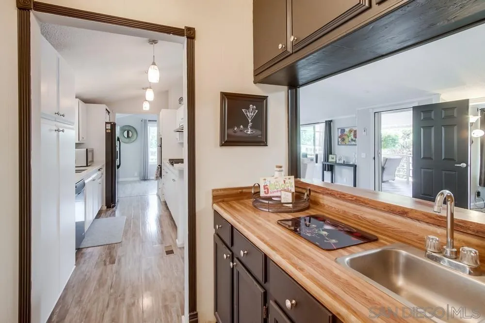 18218 Paradise Mountain Road, Unit 75 Valley Center, CA 92082 - Photo 26 of 68 a bathroom with a sink and a mirror