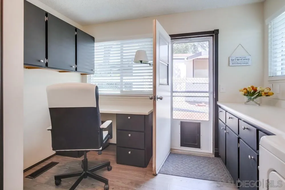 18218 Paradise Mountain Road, Unit 75 Valley Center, CA 92082 - Photo 42 of 68 a kitchen with stainless steel appliances granite countertop a refrigerator and a stove
