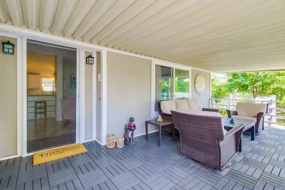 18218 Paradise Mountain Road, Unit 75 Valley Center, CA 92082 - Photo 43 of 68 a view of a dining room with furniture and wooden floor