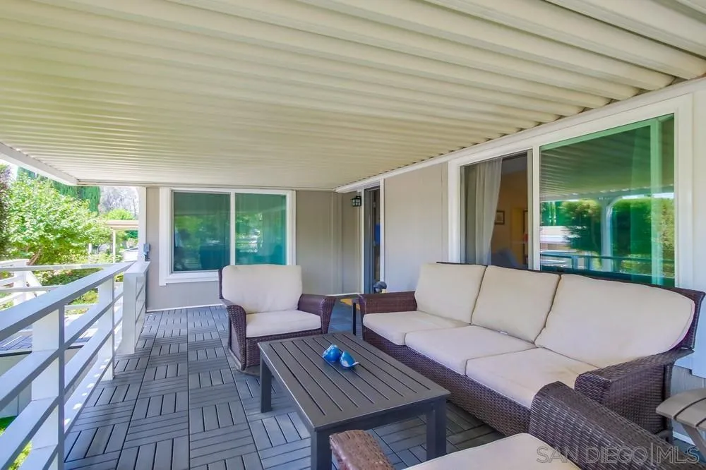 18218 Paradise Mountain Road, Unit 75 Valley Center, CA 92082 - Photo 45 of 68 a outdoor living space with patio furniture and garden view