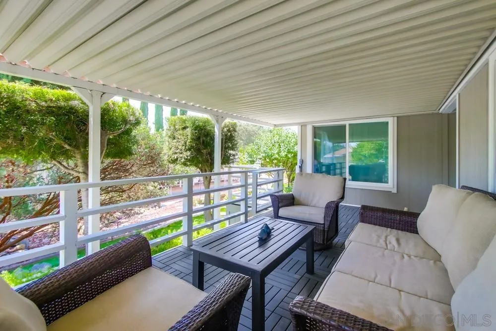 18218 Paradise Mountain Road, Unit 75 Valley Center, CA 92082 - Photo 46 of 68 a outdoor living space with furniture and garden view