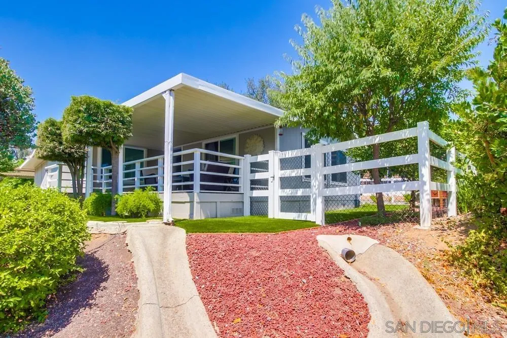 18218 Paradise Mountain Road, Unit 75 Valley Center, CA 92082 - Photo 48 of 68 a view of a house with a yard