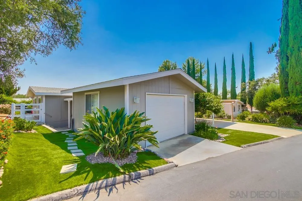 18218 Paradise Mountain Road, Unit 75 Valley Center, CA 92082 - Photo 5 of 68 a house that has a plant in front of it