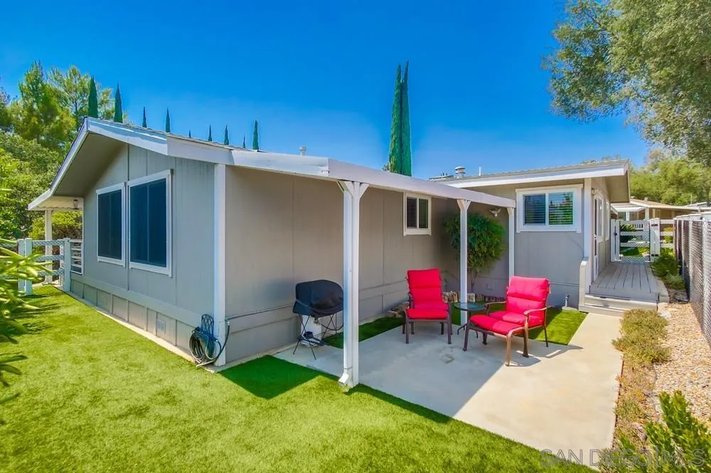 18218 Paradise Mountain Road, Unit 75 Valley Center, CA 92082 - Photo 52 of 68 a backyard of a house with outdoor seating