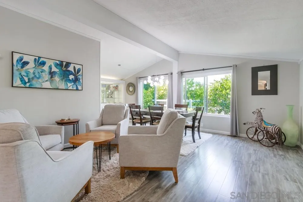 18218 Paradise Mountain Road, Unit 75 Valley Center, CA 92082 - Photo 10 of 68 a living room with furniture and a wooden floor