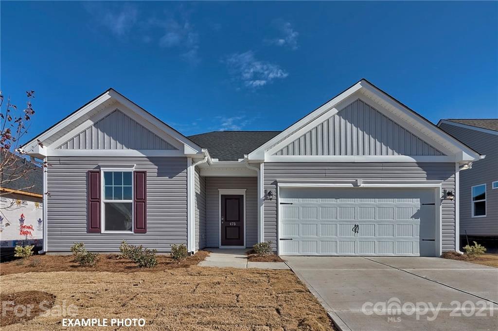 7392 Latham Way, Unit 6 Raleigh, NC 27604 - Photo 1 of 3 a front view of a house with a yard