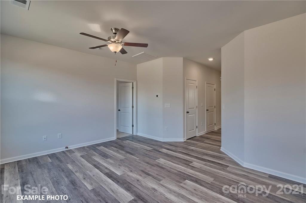 7392 Latham Way, Unit 6 Raleigh, NC 27604 - Photo 3 of 3 a view of a livingroom with a ceiling fan and window