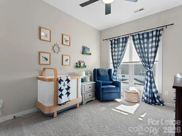 a living room with a couch and a window