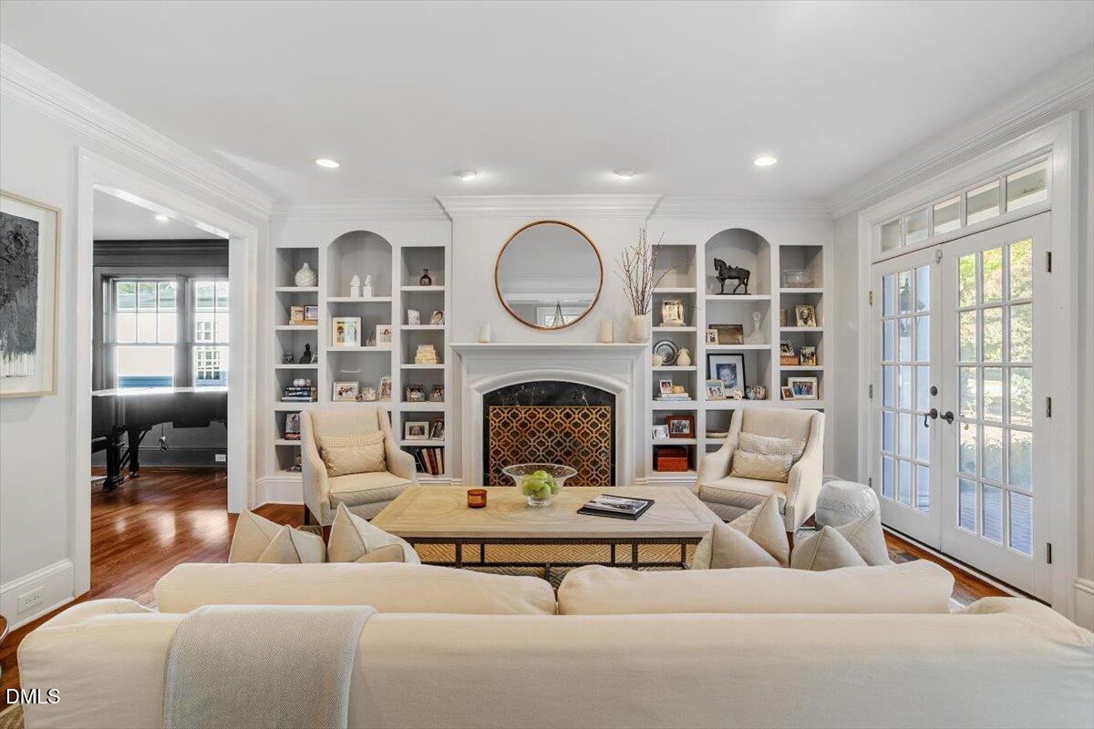1015 Harvey Street Raleigh, NC 27608 - Photo 9 of 95 a living room with furniture and a fireplace