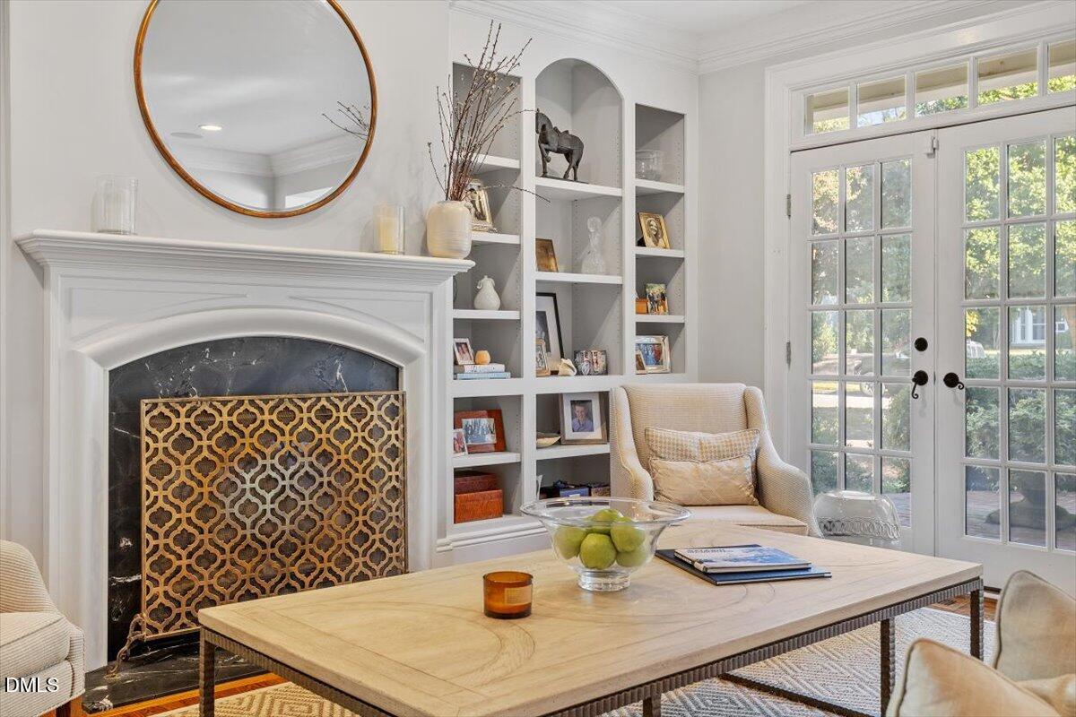 1015 Harvey Street Raleigh, NC 27608 - Photo 14 of 95 a living room with a table chairs and a fireplace