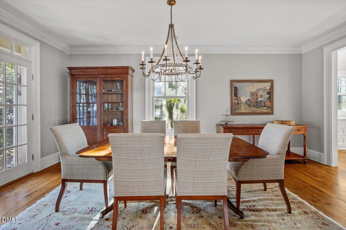 1015 Harvey Street Raleigh, NC 27608 - Photo 16 of 95 a view of a dining room with furniture window and wooden floor