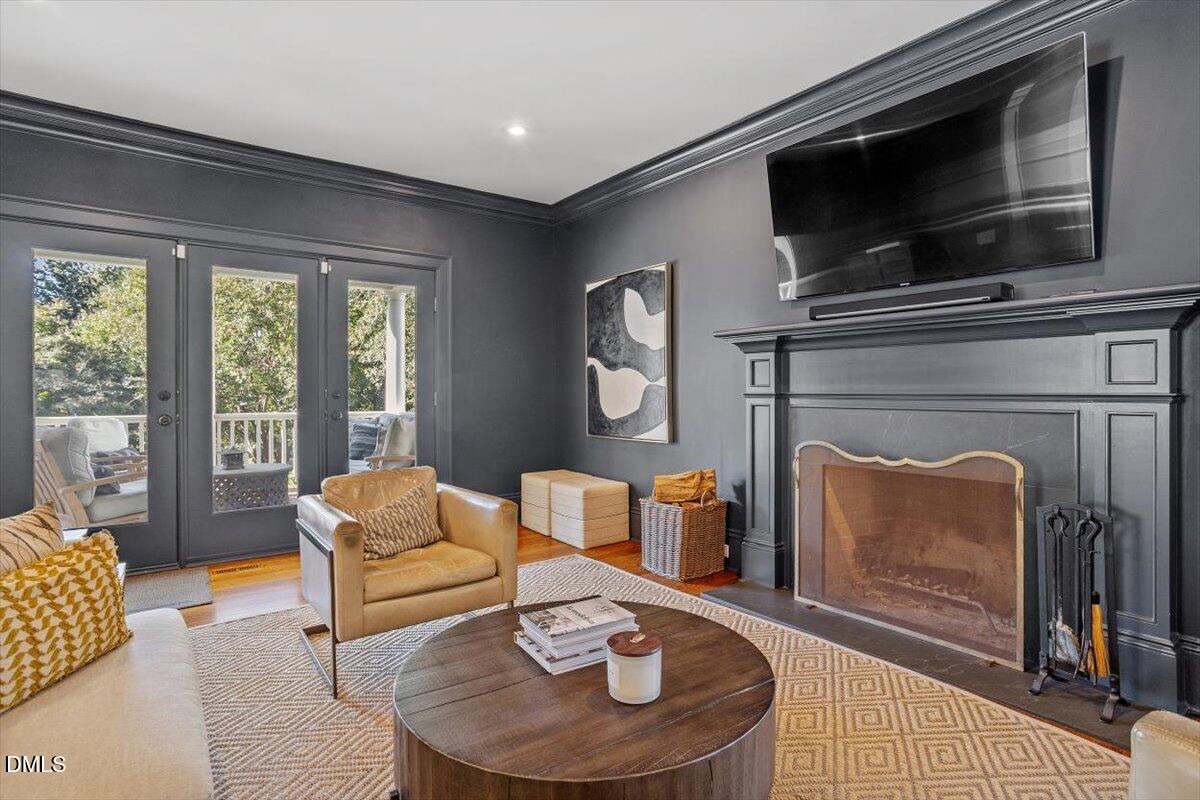 1015 Harvey Street Raleigh, NC 27608 - Photo 35 of 95 a living room with furniture and a fireplace