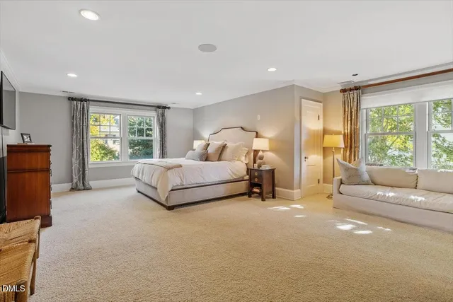 an aerial view of a house with a yard and garden