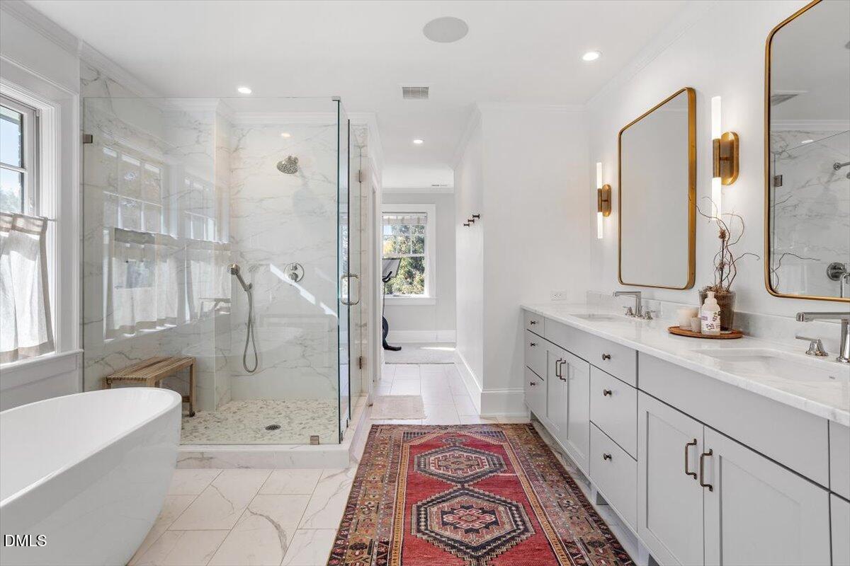 1015 Harvey Street Raleigh, NC 27608 - Photo 40 of 95 a spacious bathroom with a double vanity sink toilet mirror and bathtub
