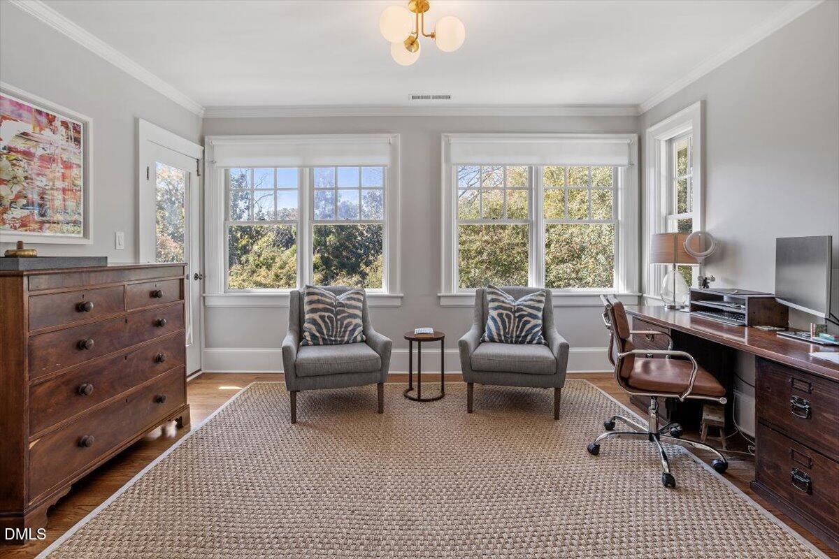 1015 Harvey Street Raleigh, NC 27608 - Photo 48 of 95 a living room with furniture wooden floor and windows