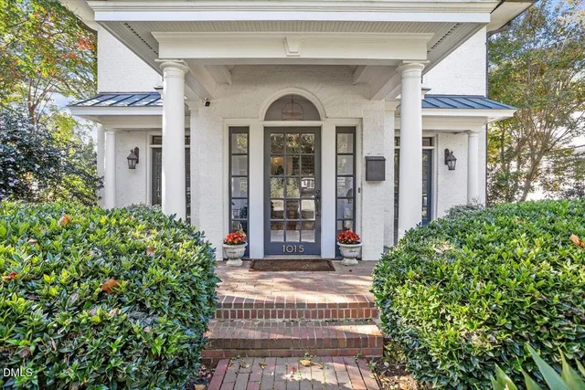 a living room with fireplace furniture and a wooden floor
