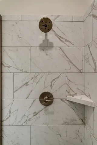 a table with a vase and a chandelier fan