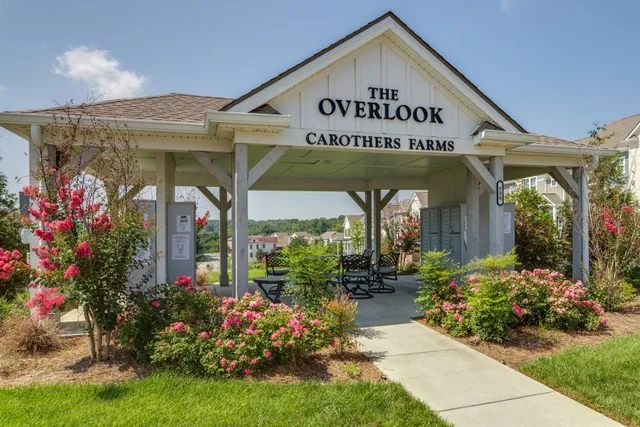 a view of a house with a flower garden