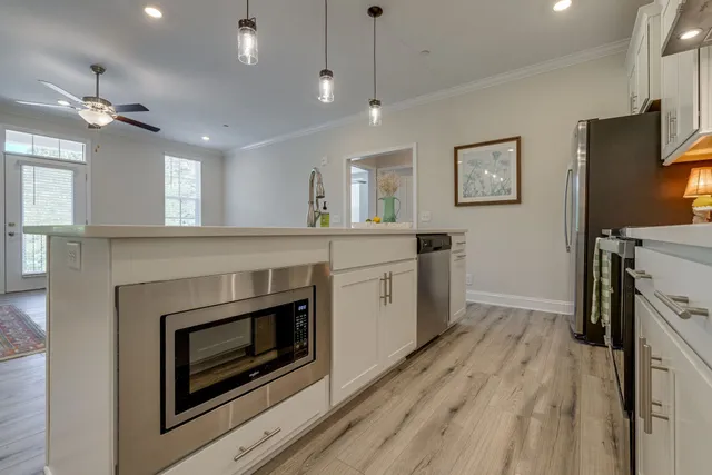 a kitchen with a stove oven and a fireplace