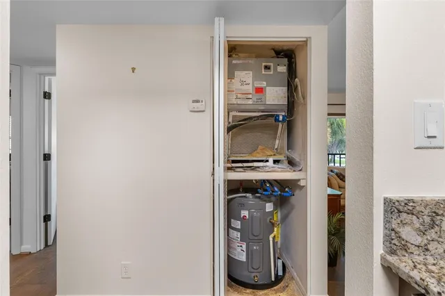 a view of a bedroom with a bed and a window