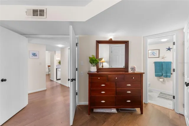 a bathroom with a toilet a sink and a mirror