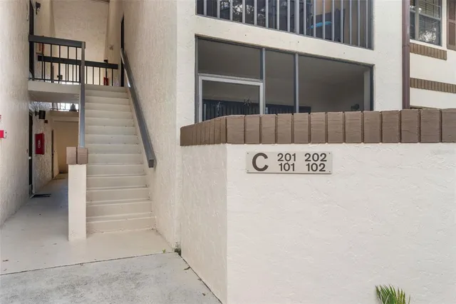 a house with swimming pool in front of it