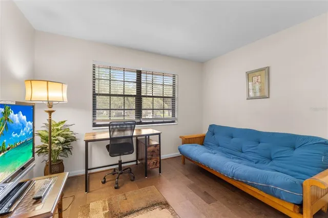 a view of a livingroom with furniture and a flat screen tv