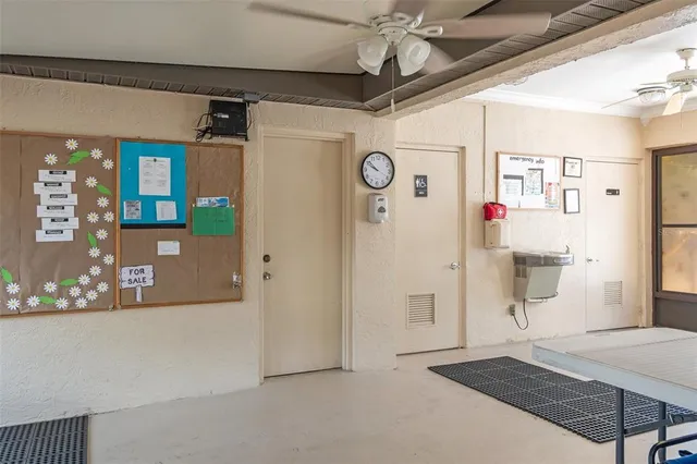 a view of a livingroom with furniture and a bookshelf