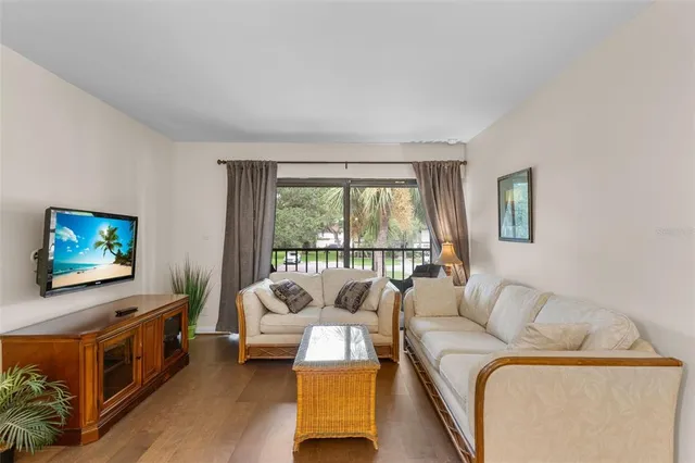 a living room with furniture and a large window