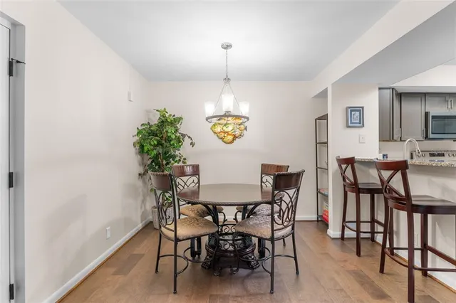 a kitchen with a table and chairs in it