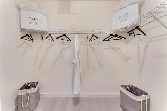 a bedroom with a bed and dresser