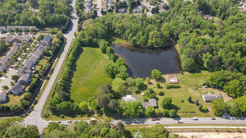 2192 Prospect Road Lawrenceville, GA 30043 - Photo 4 of 6 an aerial view of a residential houses with yard and lake view