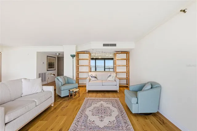 a bathroom with a granite countertop sink and a large mirror