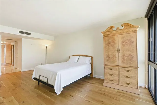 a bathroom with a glass shower door and a shower