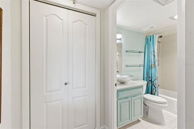a living room with furniture and a large mirror