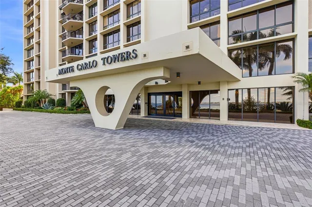 a lobby with furniture and a wooden floor