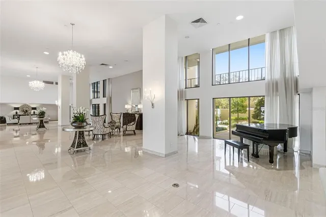 a view of swimming pool with palm trees