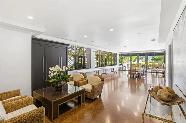 an aerial view of residential houses with outdoor space and pool view
