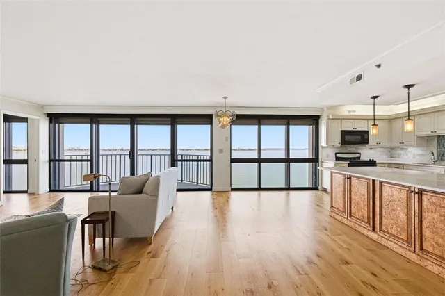 a large kitchen with cabinets and stainless steel appliances