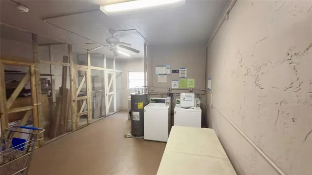 a room with lots of appliances and cabinets