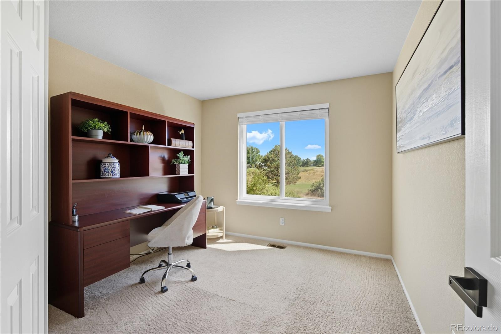 5126 Tuscany Court Highlands Ranch, CO 80130 - Photo 16 of 50 a view of a workspace with furniture and a window