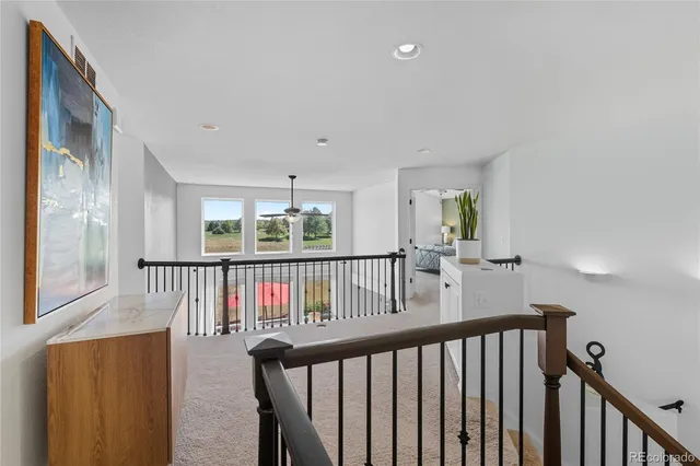 a view of hallway with furniture