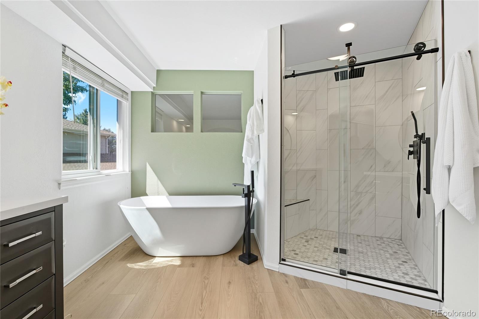 5126 Tuscany Court Highlands Ranch, CO 80130 - Photo 26 of 50 a bathroom with a bathtub and shower