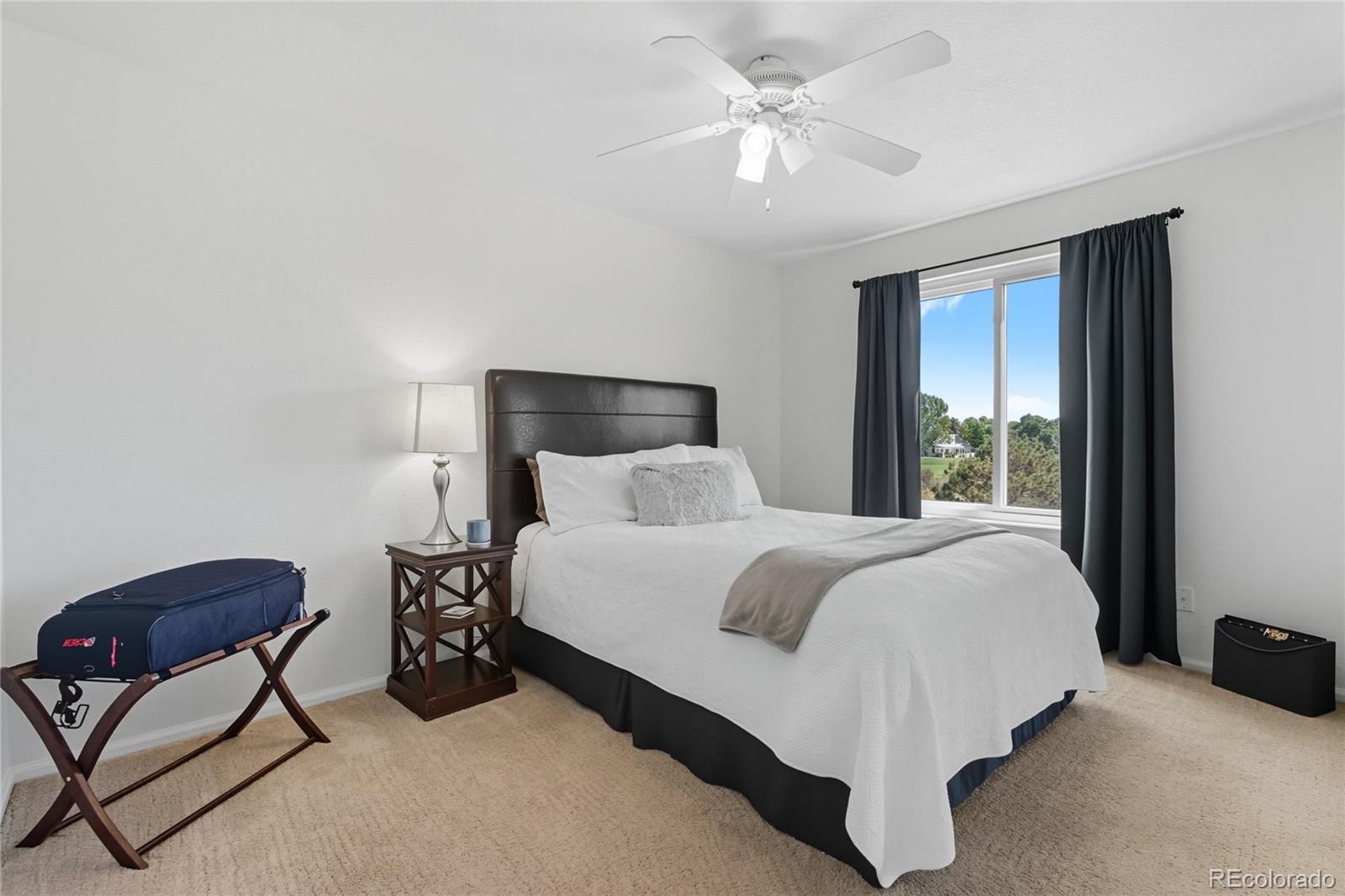 5126 Tuscany Court Highlands Ranch, CO 80130 - Photo 28 of 50 a bed room with a bed and a chair