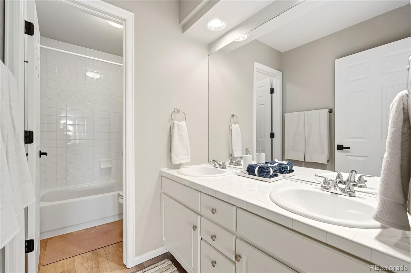5126 Tuscany Court Highlands Ranch, CO 80130 - Photo 34 of 50 a bathroom with double sink and a mirror